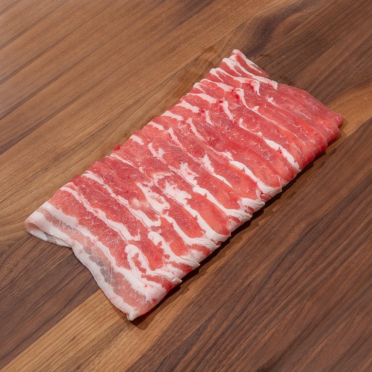 Rectangular pork belly slab with visible white fat and red meat marbling
