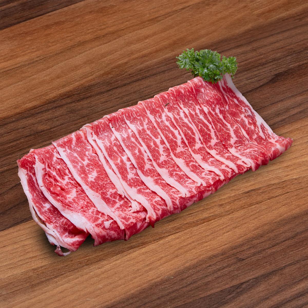 Boneless beef short ribs with visible marbling, sliced for shabu-shabu