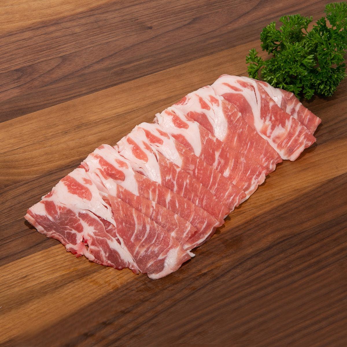 Marbled raw pork belly slices for sukiyaki