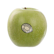 Green Granny Smith apple with speckled skin and MOUNYEAH label