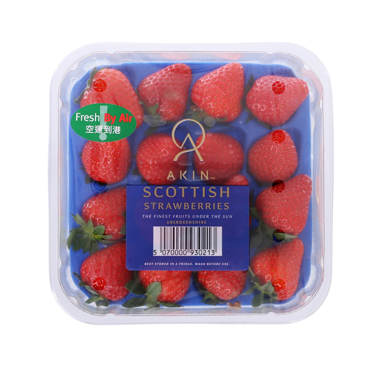 Small Scottish strawberries in clear plastic clamshell container, red berries inside