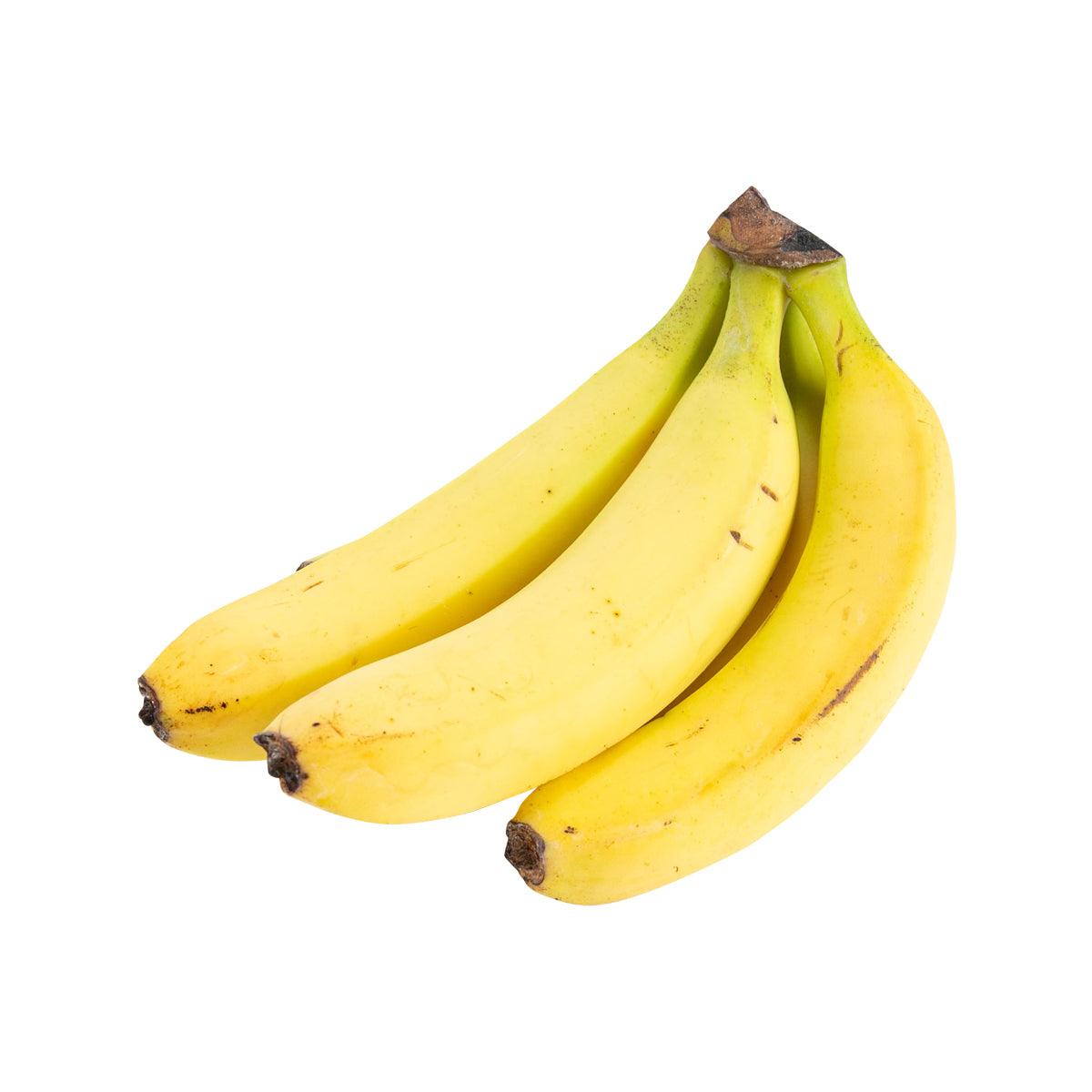 Banana bunch with three ripe yellow bananas