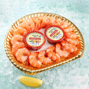 Cooked cocktail shrimp platter with two sauce cups