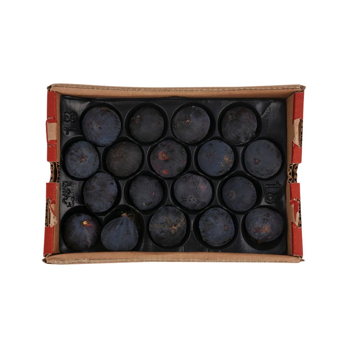 Gift box filled with dark black figs, round and whole