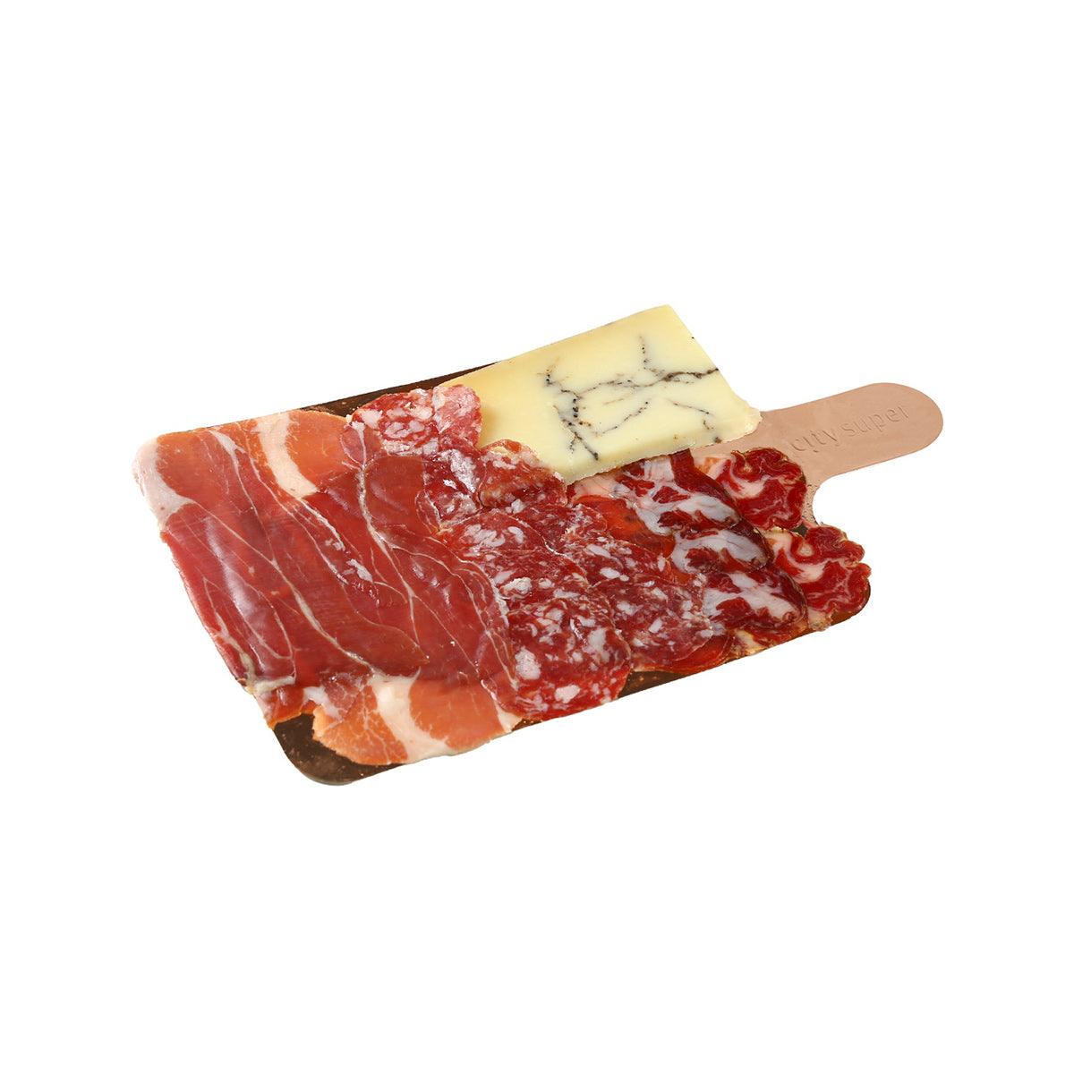 Wood deli board with prosciutto, salami and cheese slices for Italian-style serving