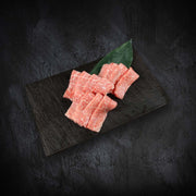 Marbled pink A5 wagyu beef slices, chilled for yakiniku grilling