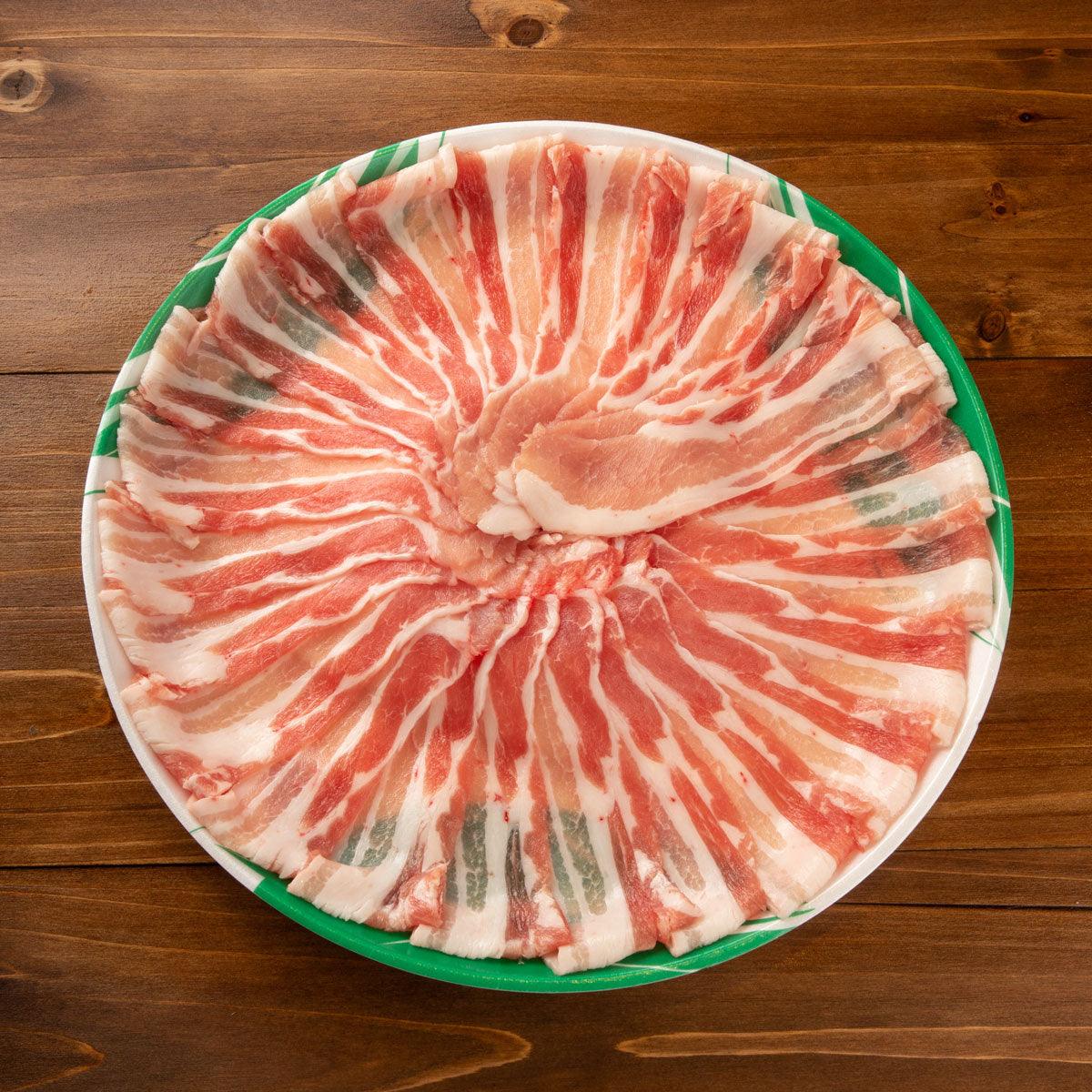 Thin-sliced pork belly shabu shabu meat on a plate