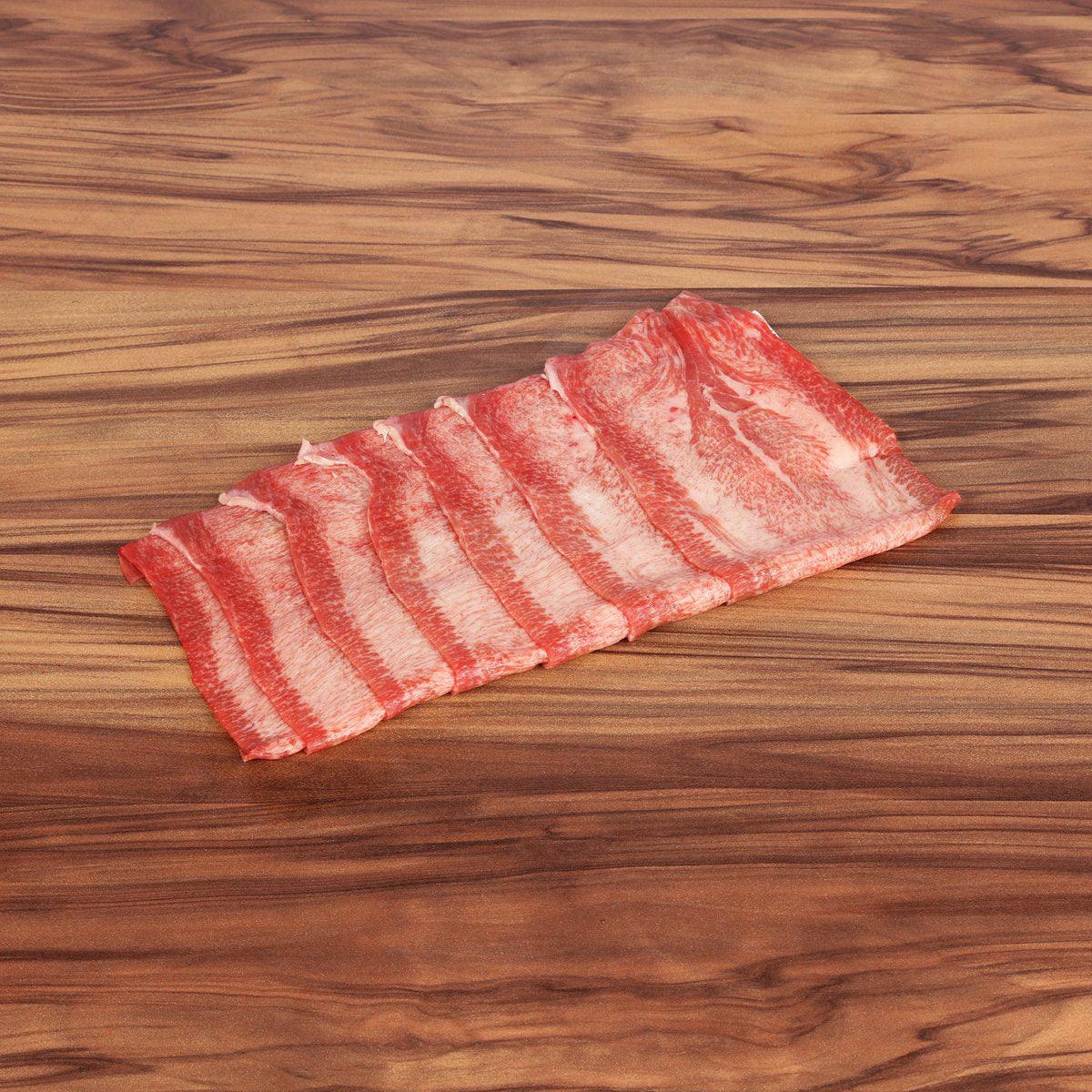 Wagyu beef tongue shabu-shabu slices, red meat with white fat stripes
