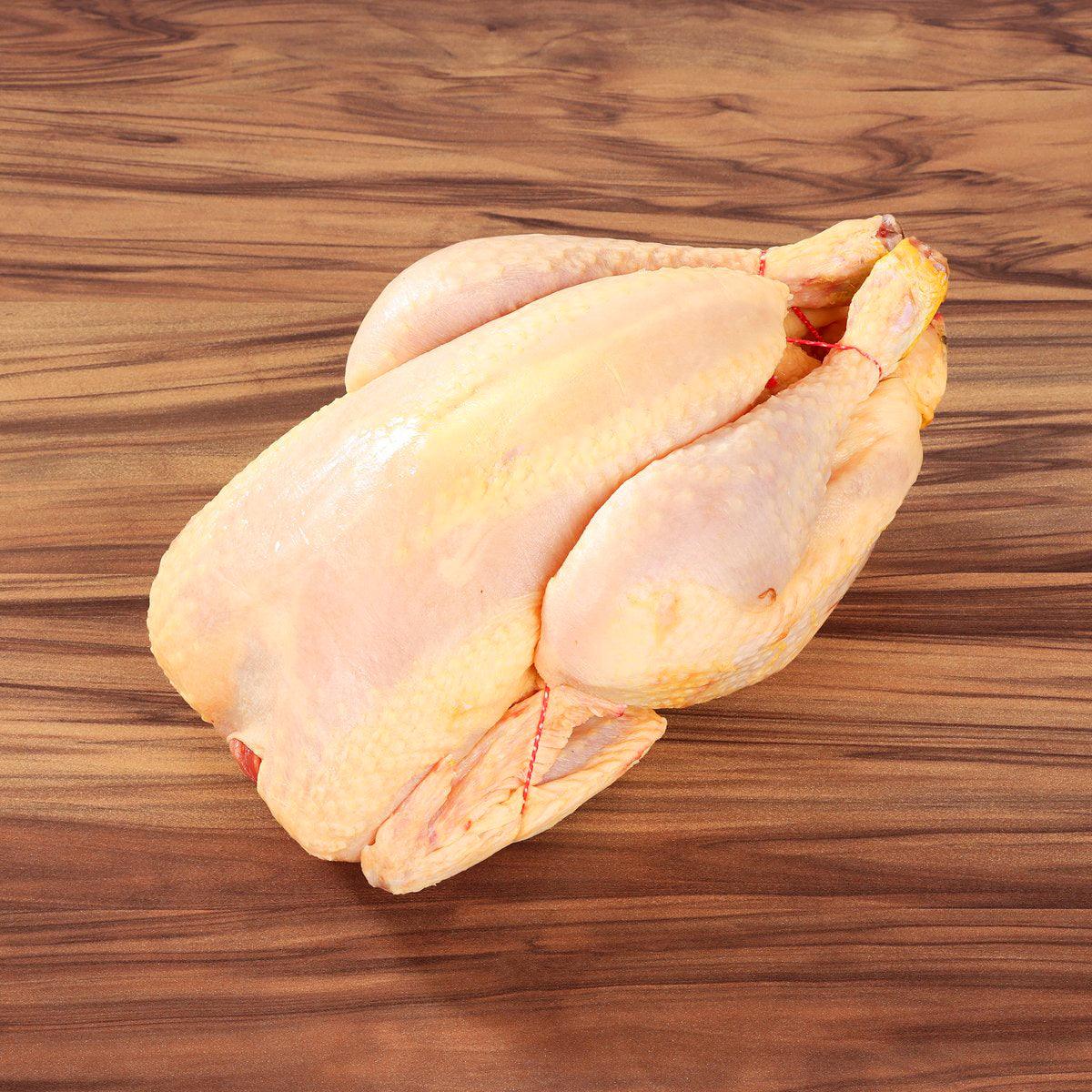 Raw yellow chicken portions with skin on