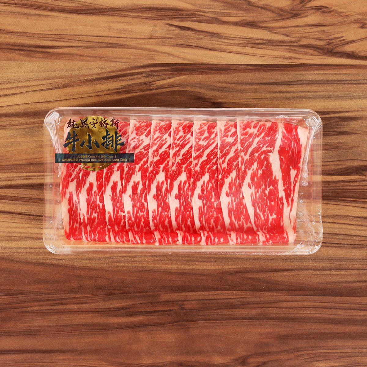 Beef short rib slices in clear plastic tray with label, red and white marbling
