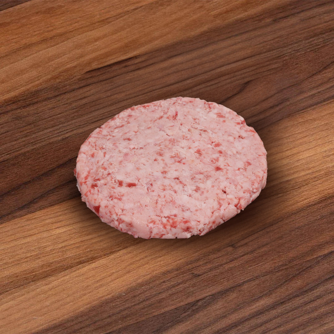 Frozen wagyu beef burger patty, round pink marbled disc