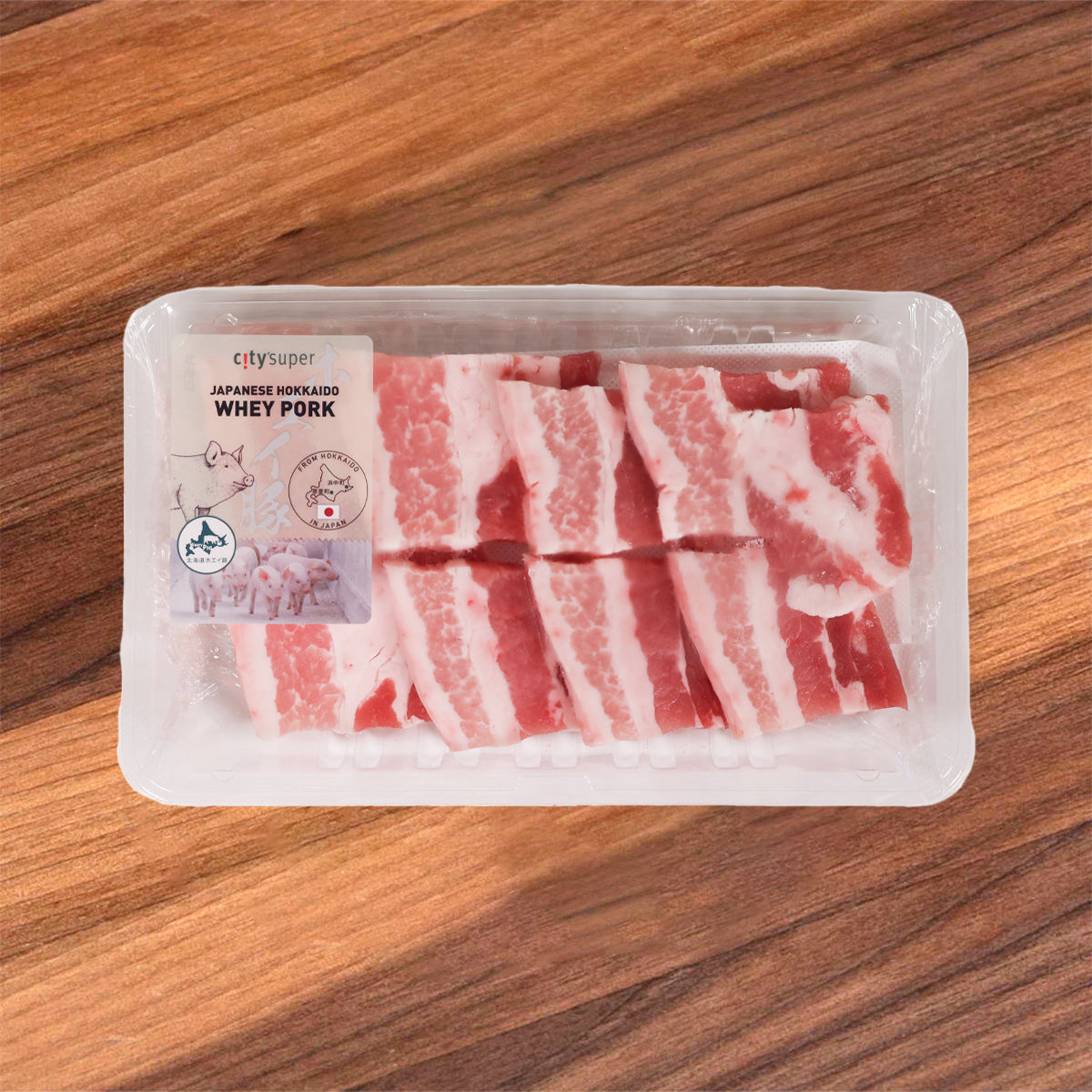 Hokkaido pork belly slices in clear plastic tray, previously frozen