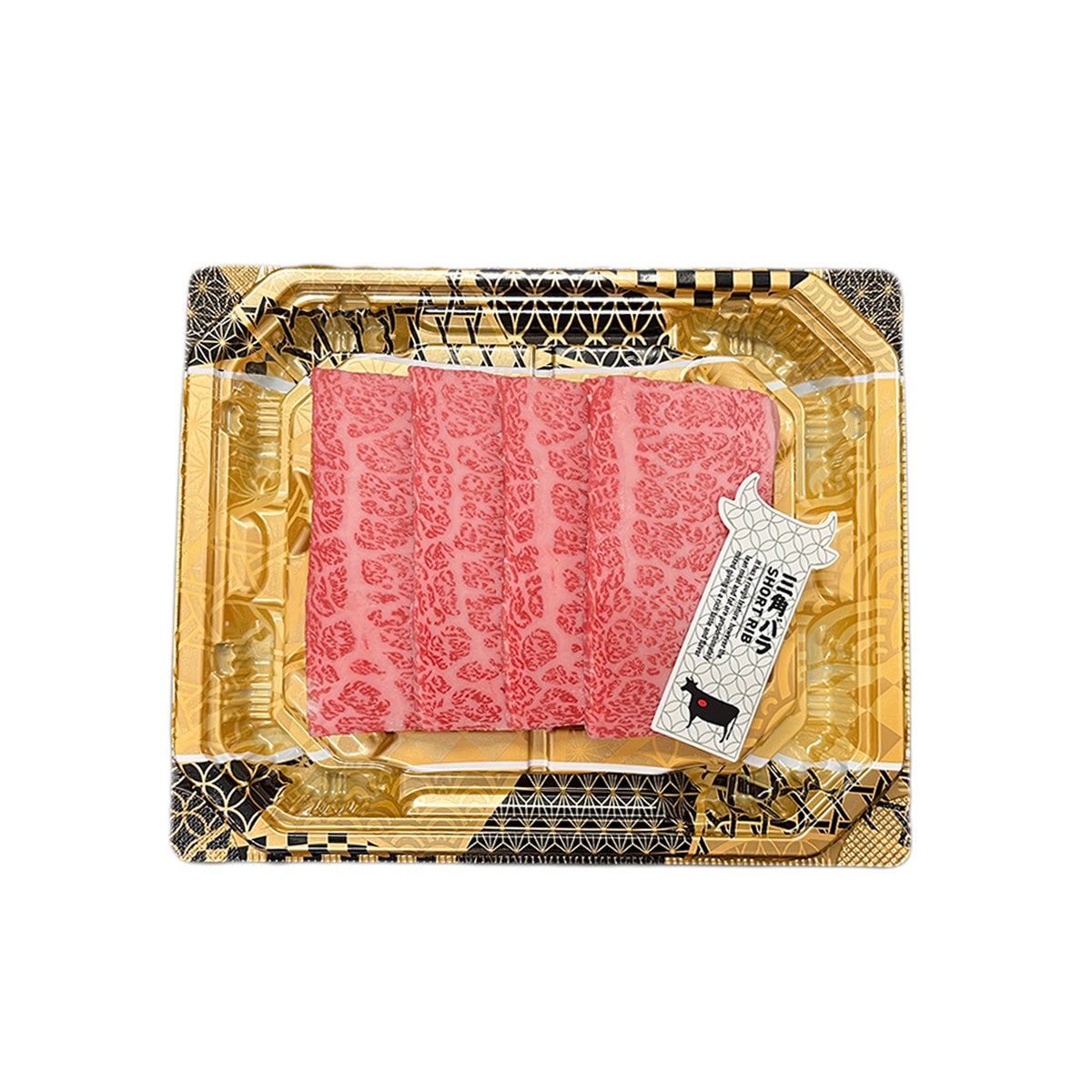 Vacuum-sealed pink marbled wagyu beef slices in decorative gold tray