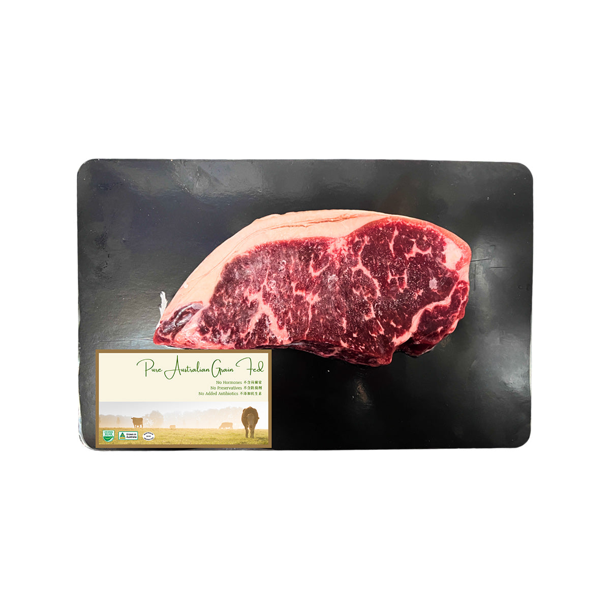 Frozen beef striploin steak on black tray with small product label sticker