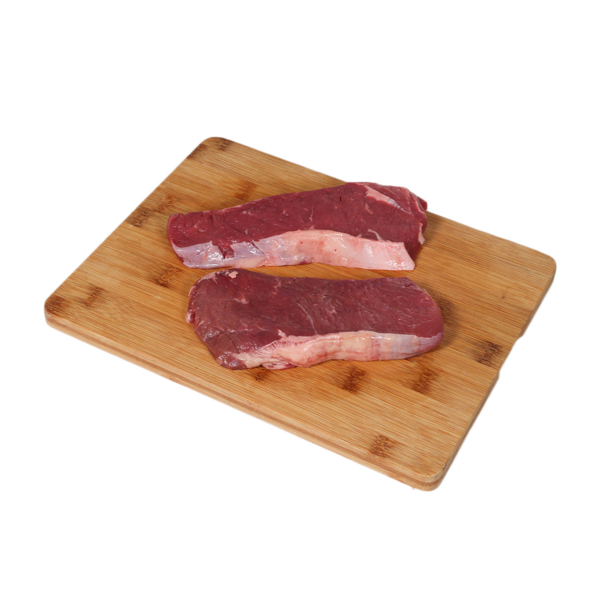 Organic beef steaks, two marbled pieces on a wooden cutting board