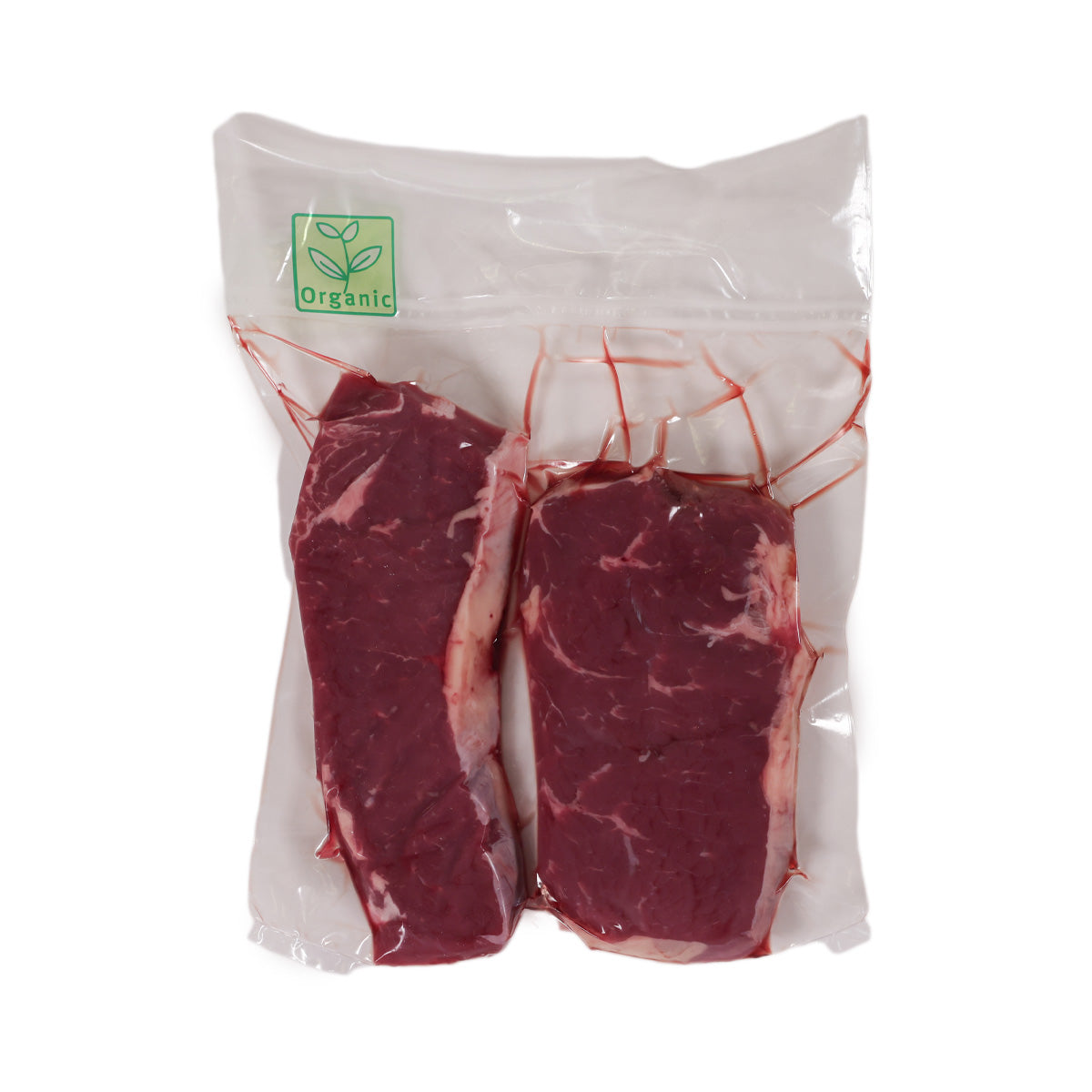 Packaged organic beef steaks in a clear plastic bag with green organic logo