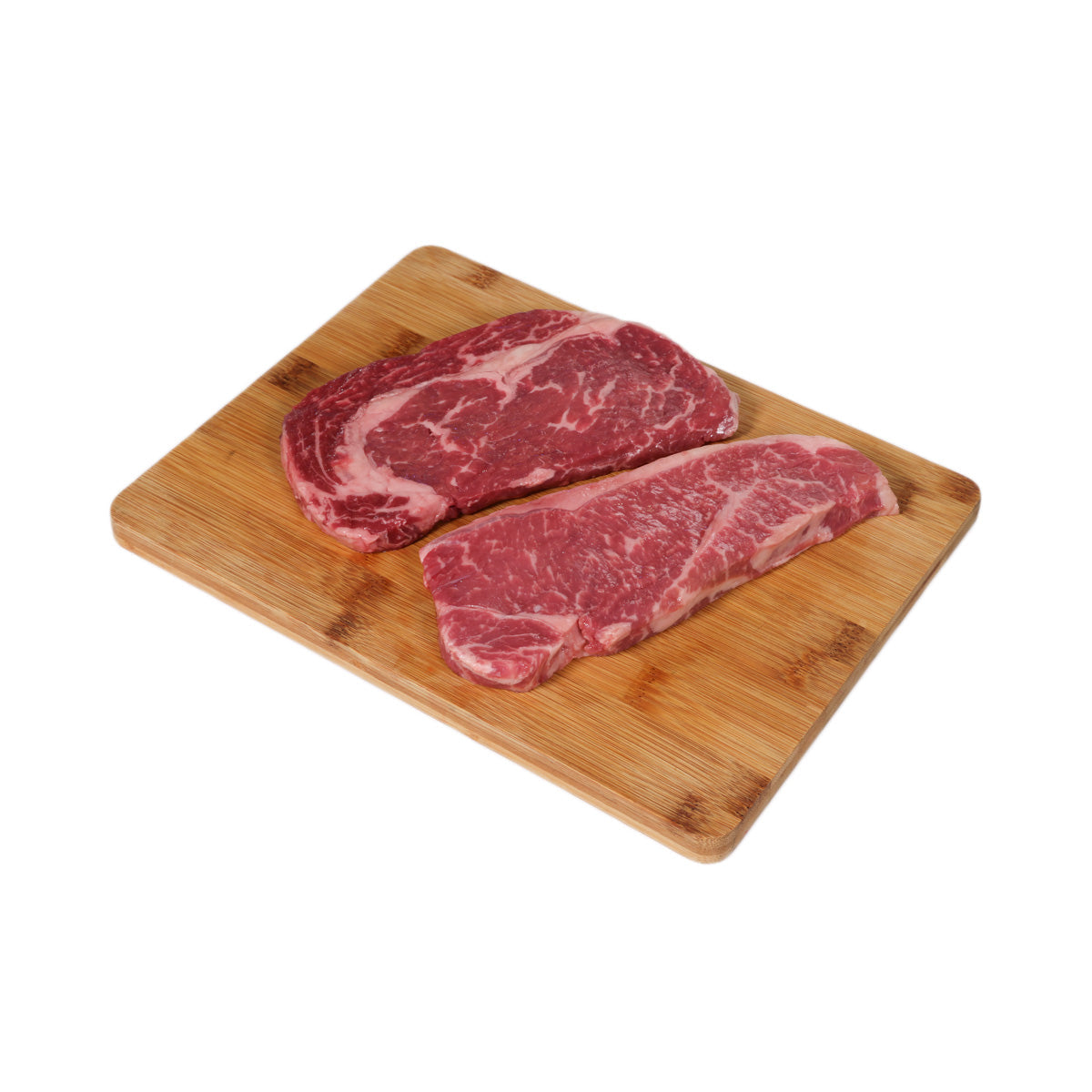 Prime Black Angus beef steak set: two marbled steaks on bamboo board