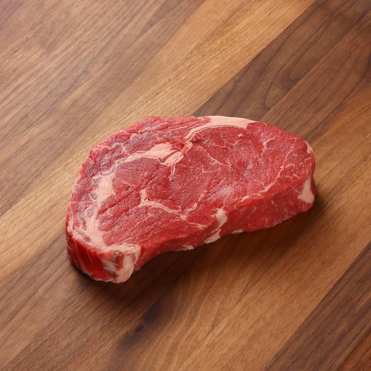 Chilled beef ribeye steak, red cut with visible white marbling