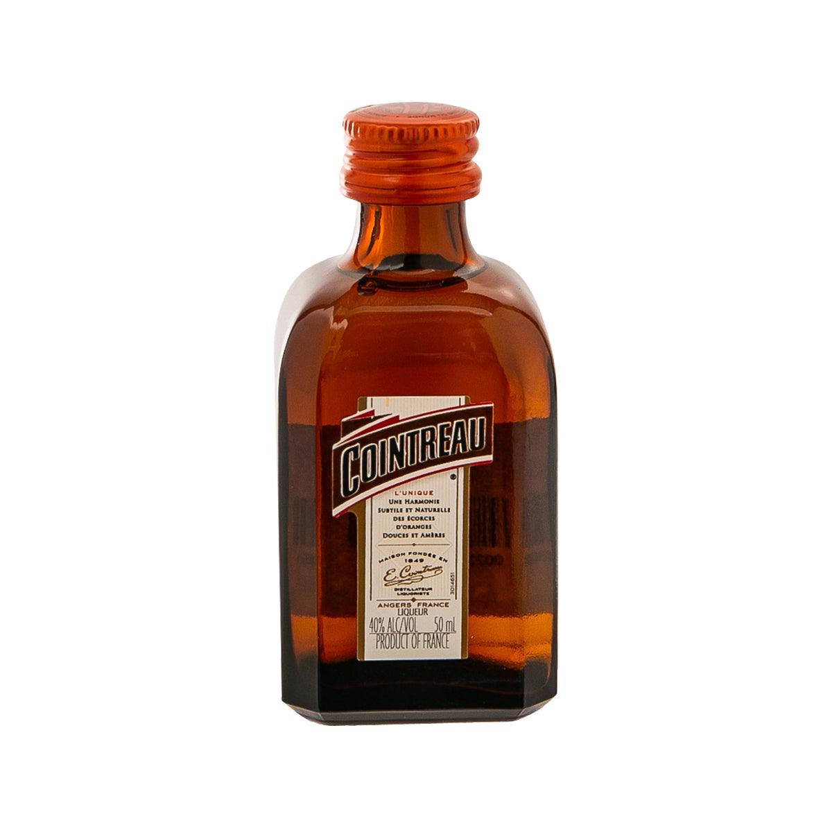 COINTREAU liqueur bottle with amber glass and orange cap, front label visible