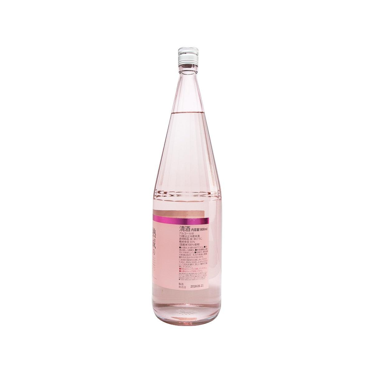 JOZEN aged Junmai Ginjo sake bottle, clear glass with pink label