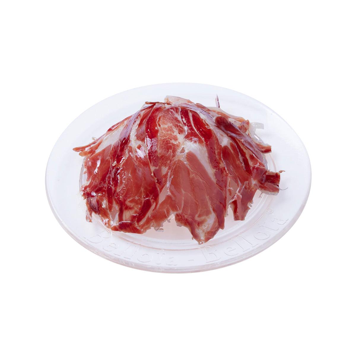BELLOTA BELLOTA hand-sliced Extremadura ham on white plate