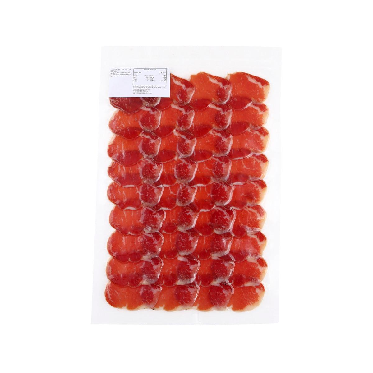 Vacuum-sealed cured pork loin slices with a product label sticker on the pack