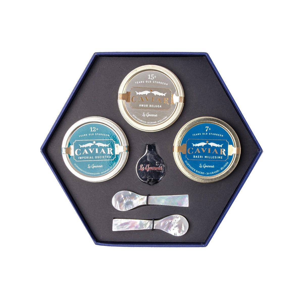 Caviar tasting set in hex gift box, featuring three caviar tins and serving spoons