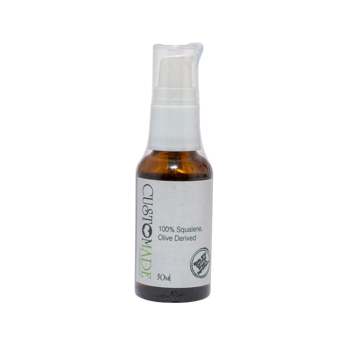Olive-derived squalene spray bottle, amber glass with white pump and front label