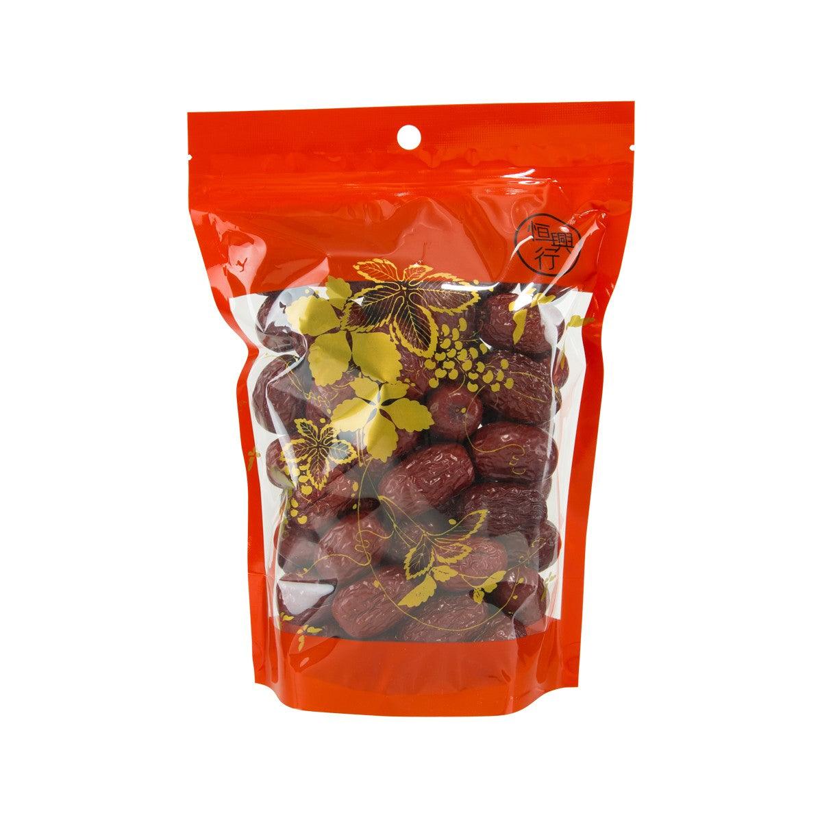 Red dates in orange pouch, with visible dried fruit pieces inside