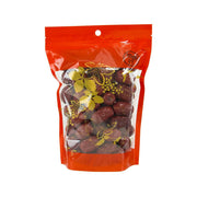 Red dates in orange pouch, with visible dried fruit pieces inside