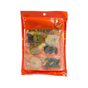 Orange herbal soup pack with visible dried ingredients through clear window