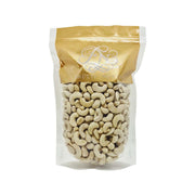 Cashews in a stand-up bag, white and beige nuts inside packaging