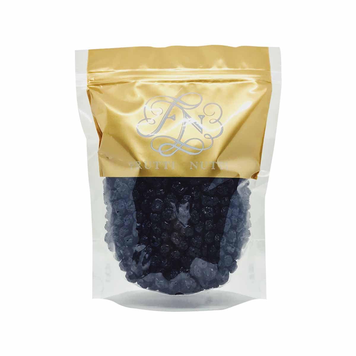 Dried blueberries in a stand-up pouch, dark blue berries with gold and white packaging