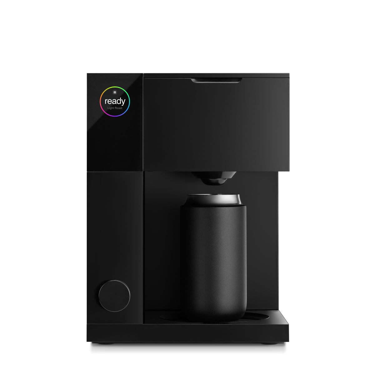 FELLOW Aiden matte black coffee maker dispensing over carafe