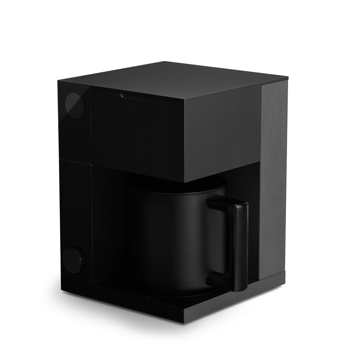 FELLOW Aiden matte black coffee maker 3/4 view with carafe and handle