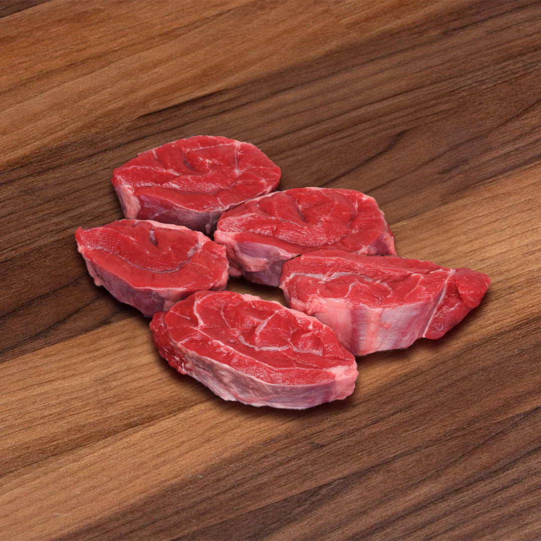 Organic beef shin chunks, red raw meat with visible marbling