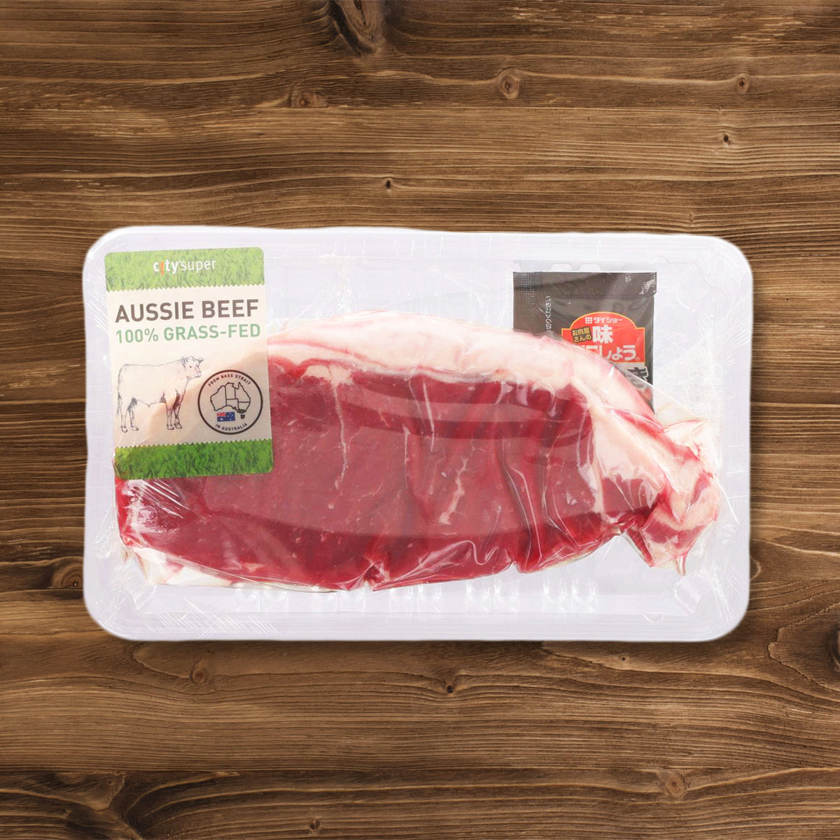 Packaged organic beef striploin in a clear tray with top label