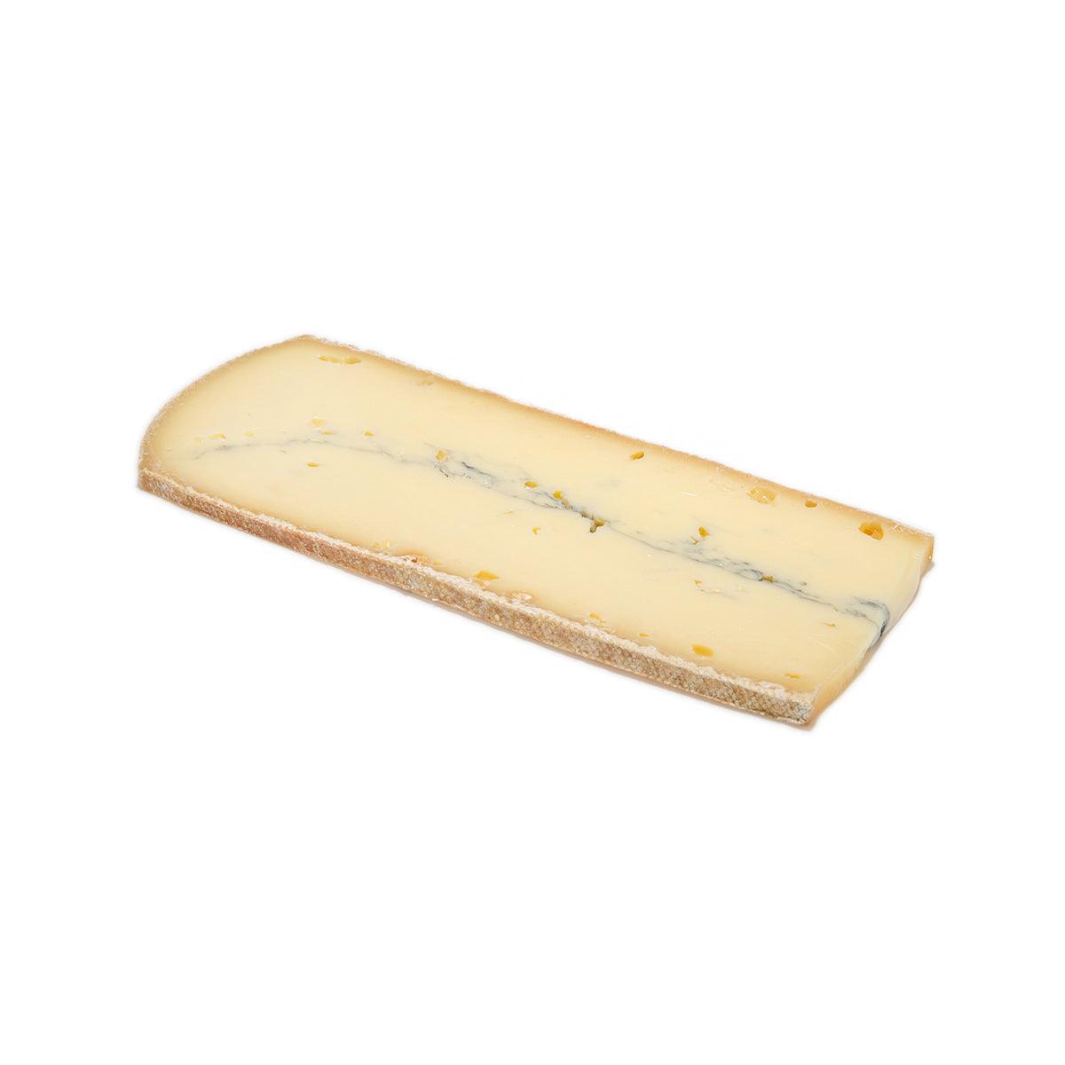 Morbier AOP raw milk cheese wedge with pale yellow base and blue mold veining
