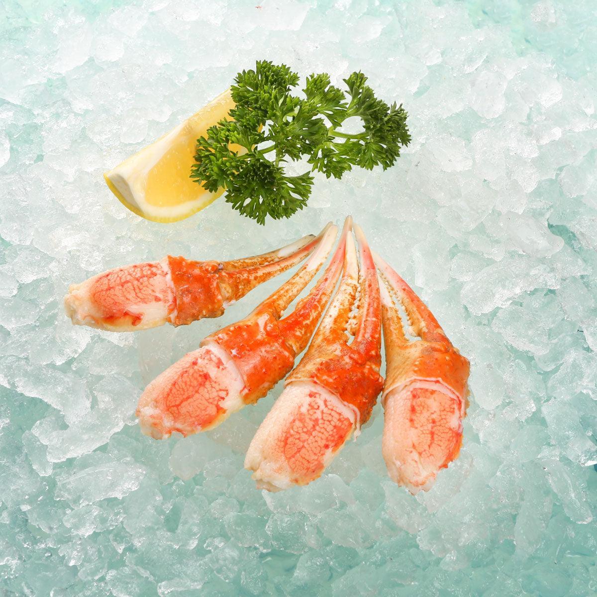 Cooked snow crab claw pieces, red-orange meat and spurs