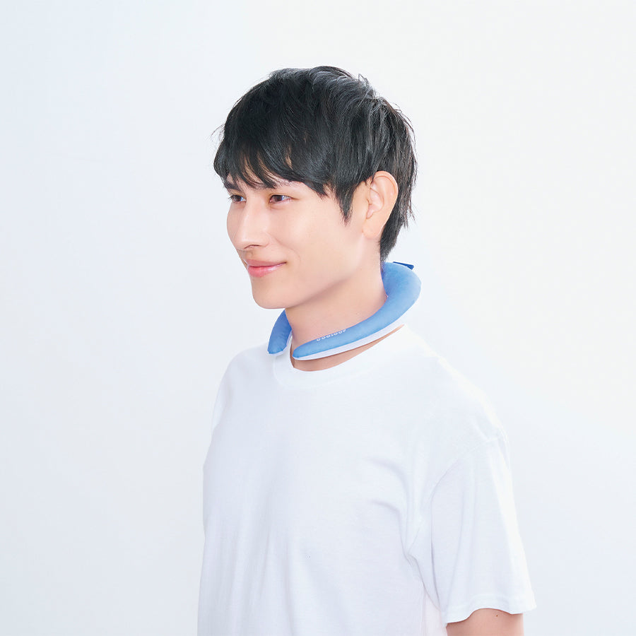 Light blue cooling neck ring worn around neck over white T-shirt
