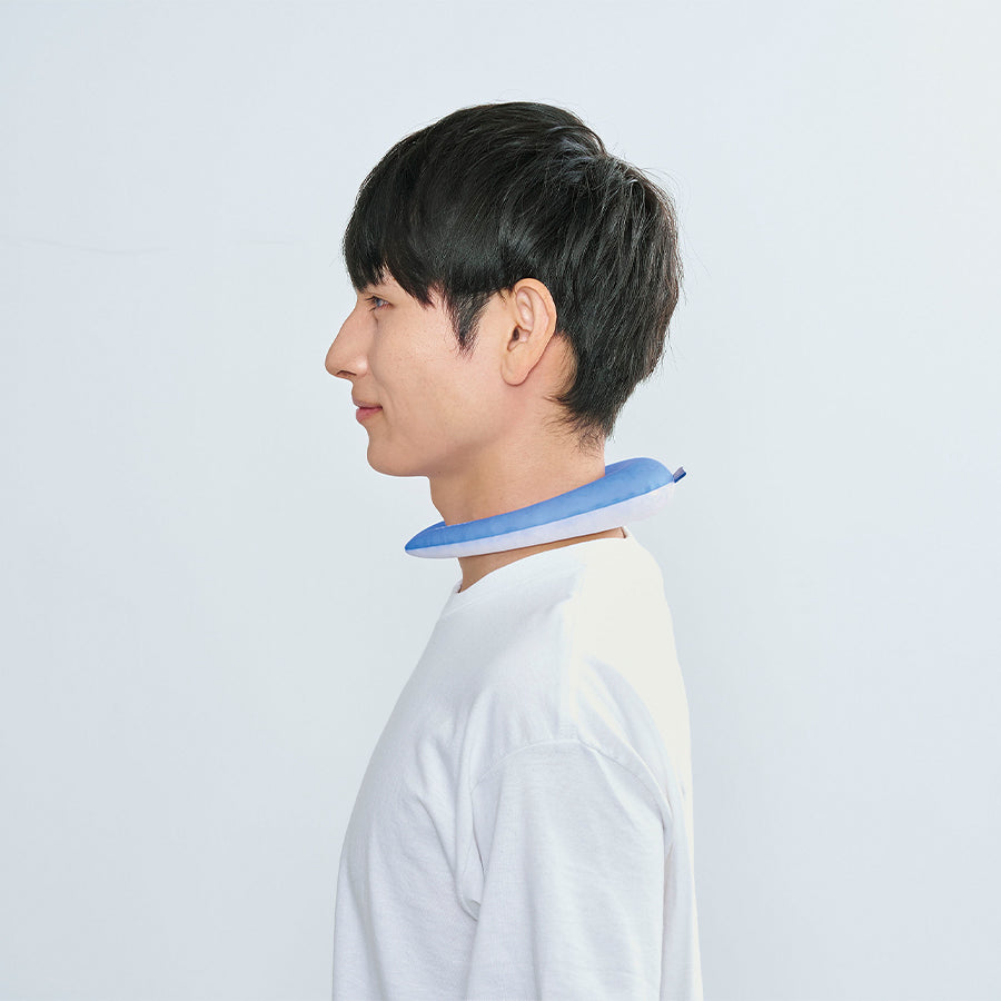 Light blue cooling neck ring worn around neck on a white T-shirt