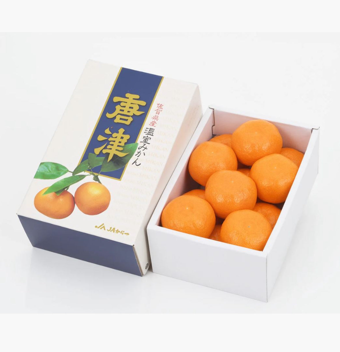 Mikan gift box with open tray of orange mandarins