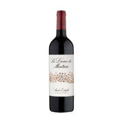 Wine bottle with red capsule and cream label reading La Dame de Montrose.