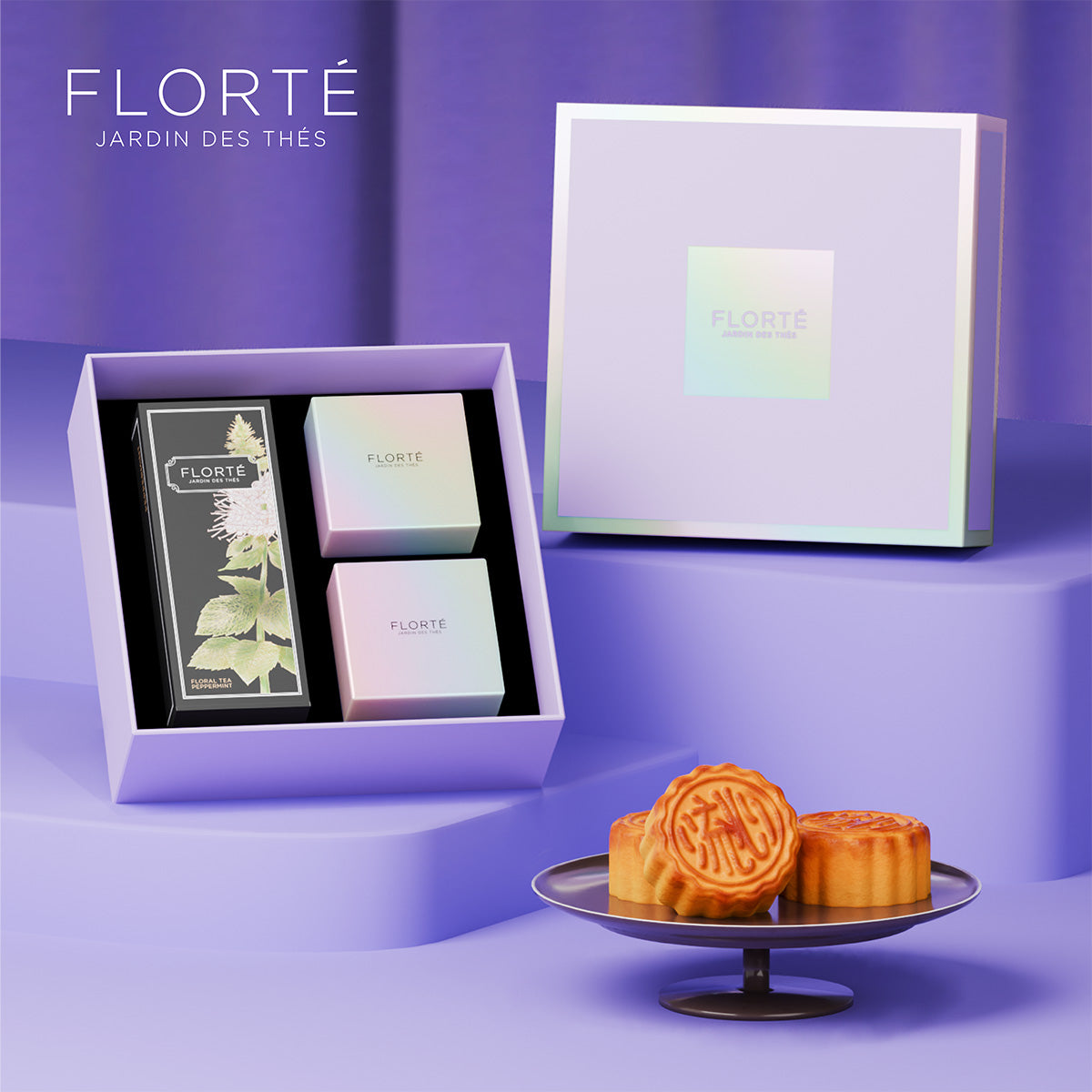 Mooncake gift set in open gift box with assorted pastries and labeled tea box