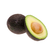 Mexican organic avocado halves with pit, shown with whole fruit