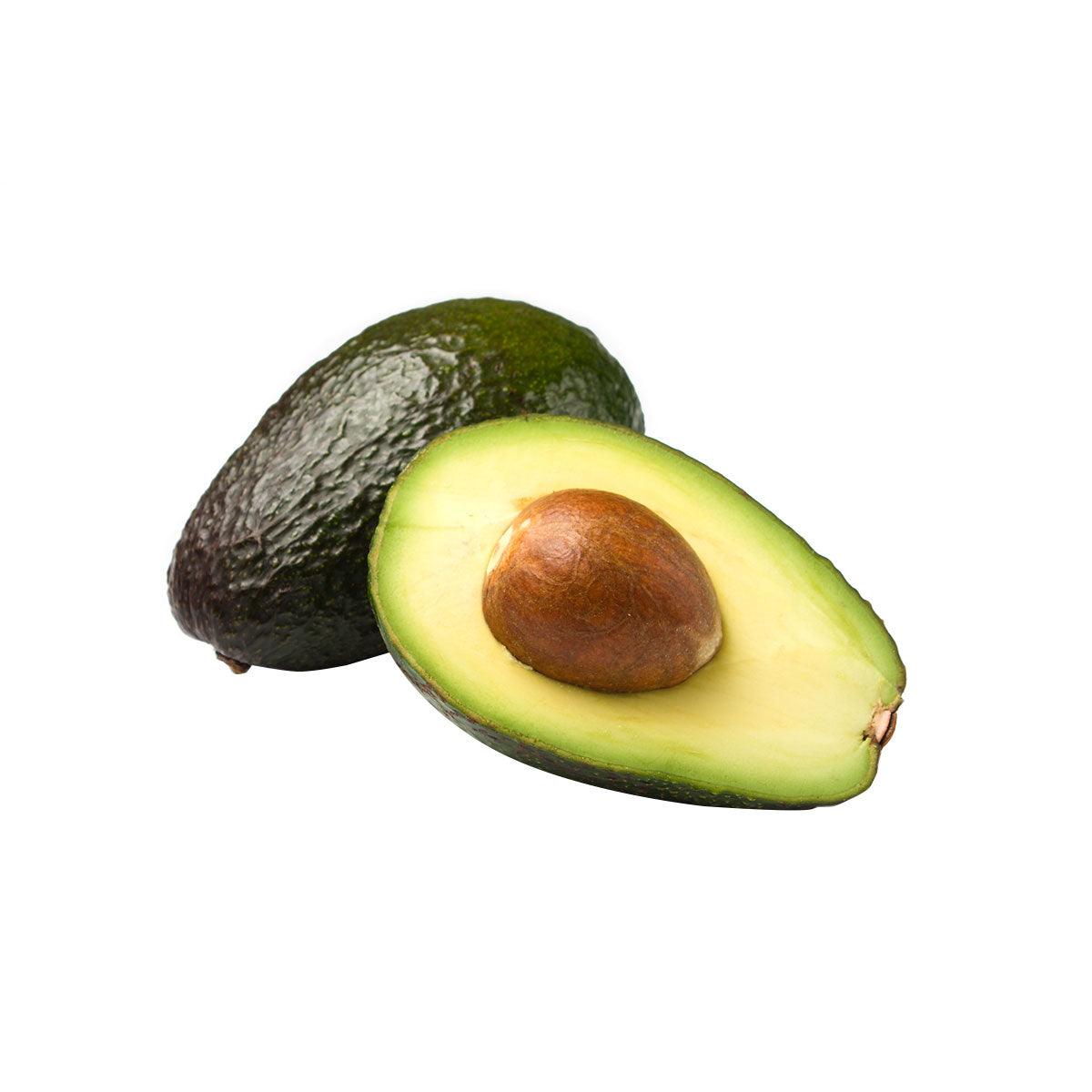 Avocado fruit, whole and halved with brown pit and green flesh