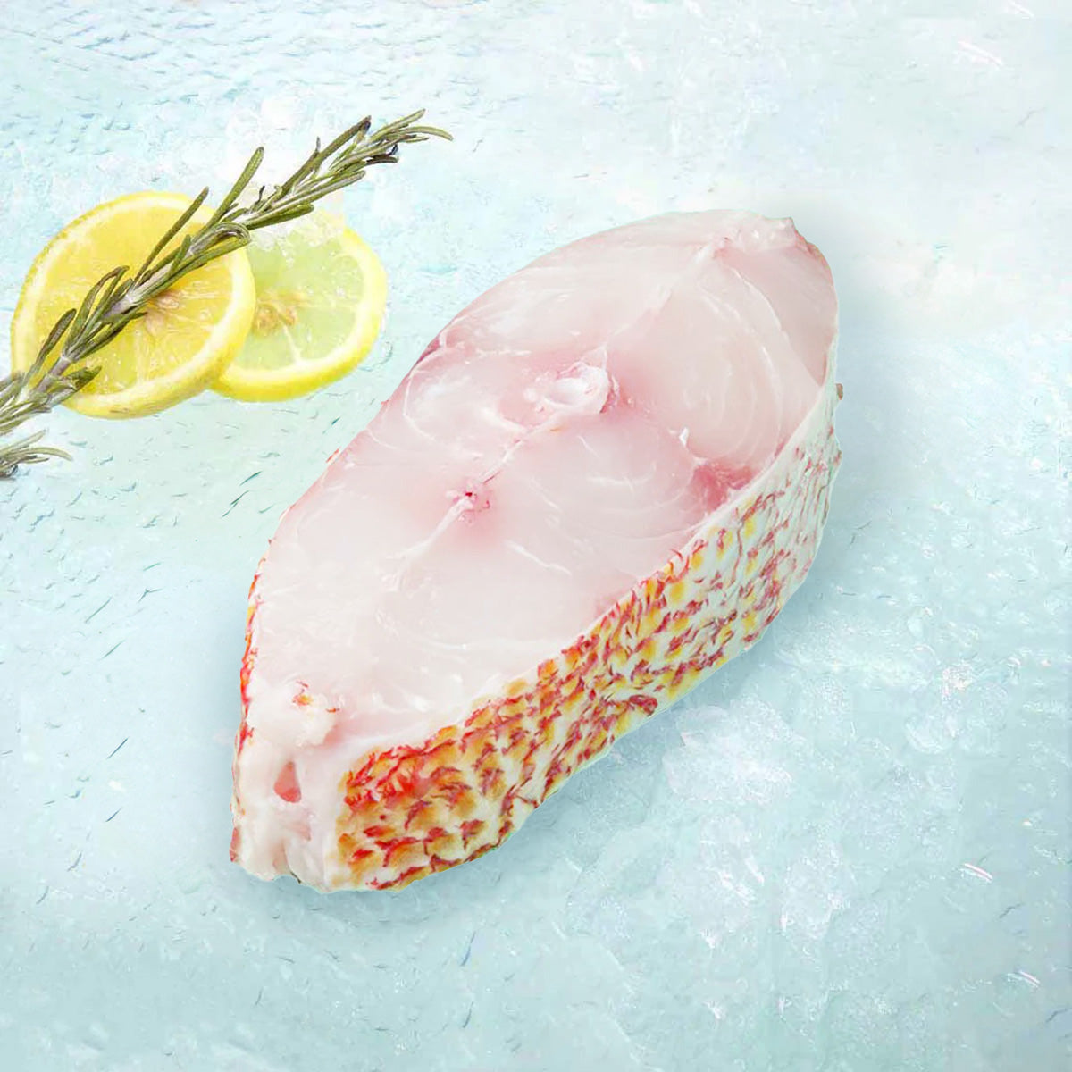 Raw red snapper fish slice with pale pink flesh and skin-on edge