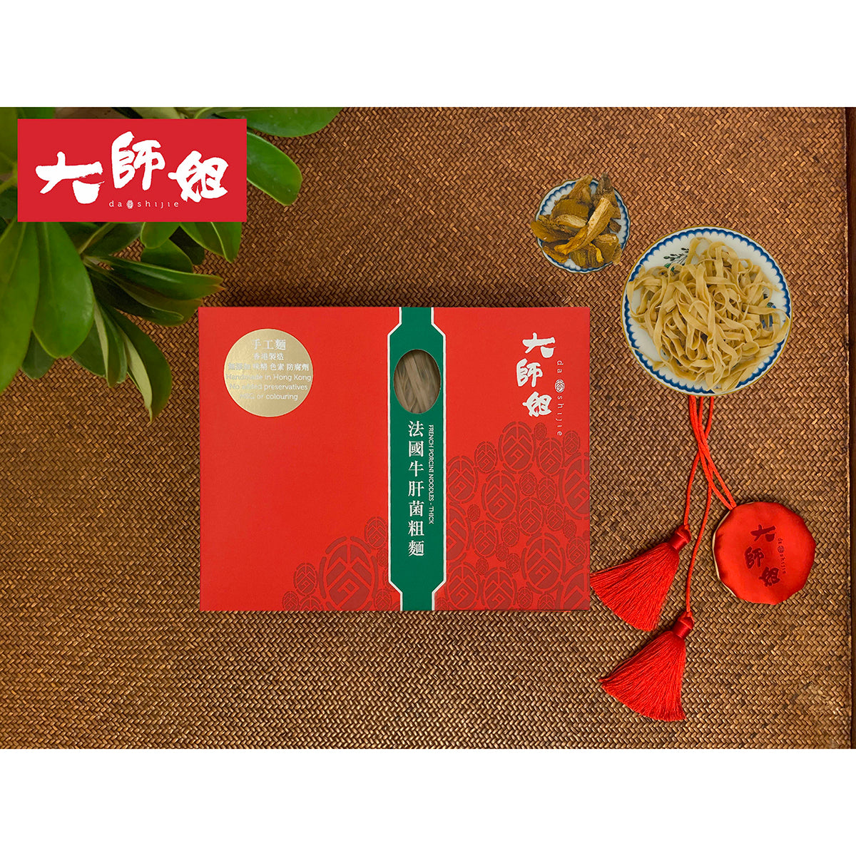 DASHIJIE porcini thick noodles 6-pack with red box, bowl of noodles, and porcini