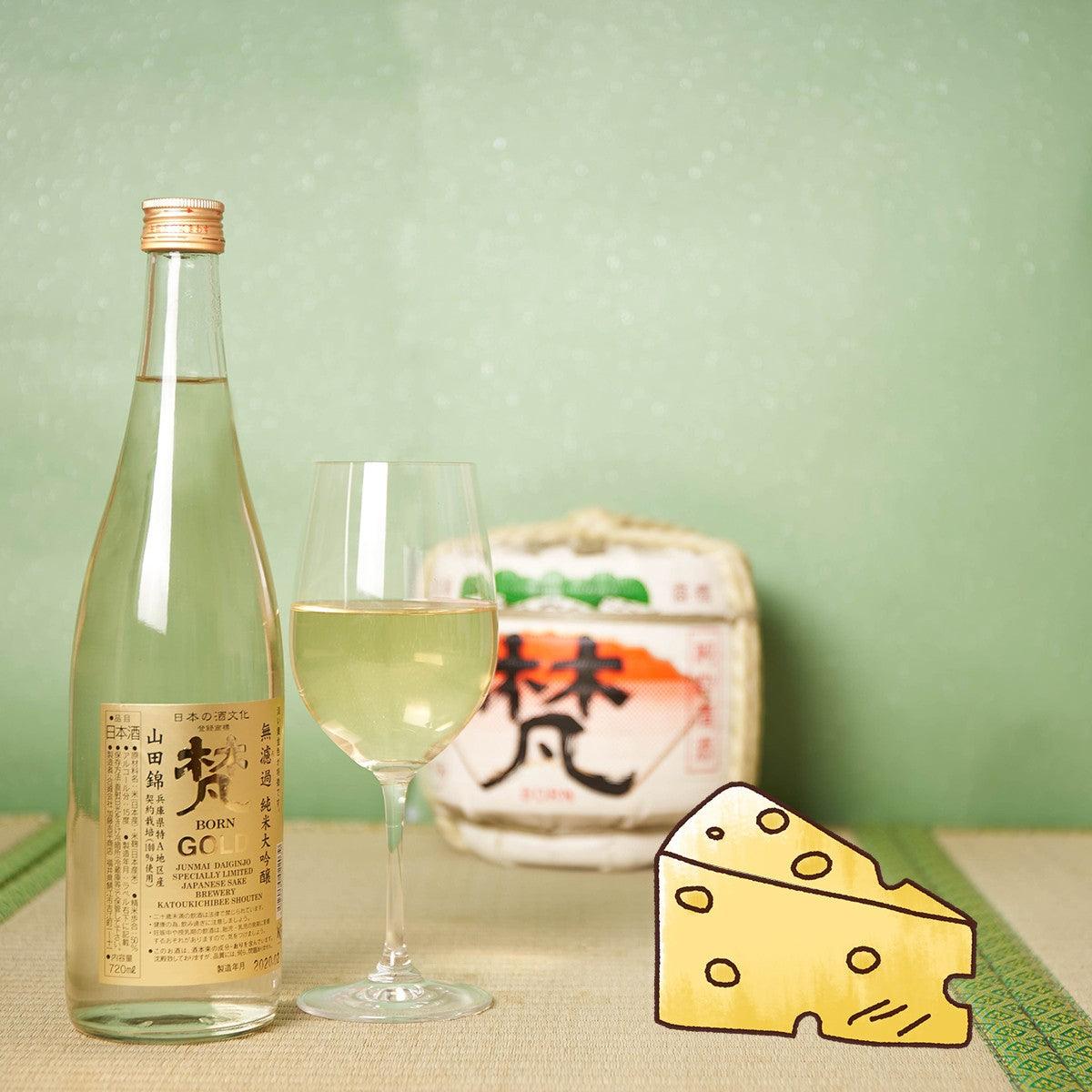 BORN Gold Junmai Daiginjo sake bottle with stemmed glass and illustrated box