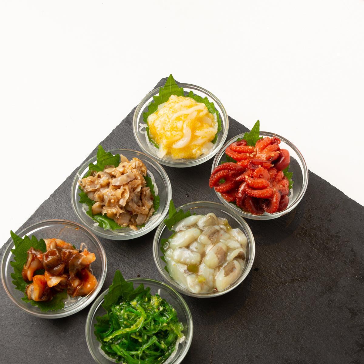 Japanese tapas set: five mini glass bowls with assorted cooked toppings